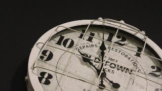 magnified clock on black background