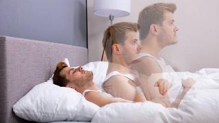 man's body in bed with effect of him getting up