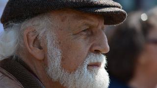 selective-focus-photography-of-man-in-flat-cap-during-daytime