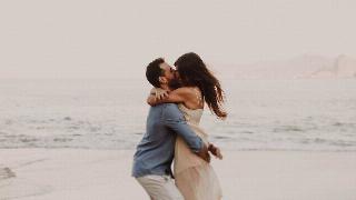 a-couple-hugging-at-the-beach-