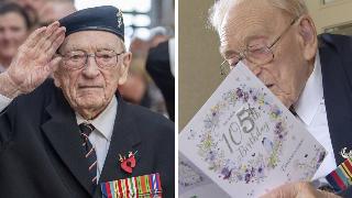 Ernest Horsfall in his beret, hand up in a salute. | Ernest Horsfall reading one of the many birthday cards he received.