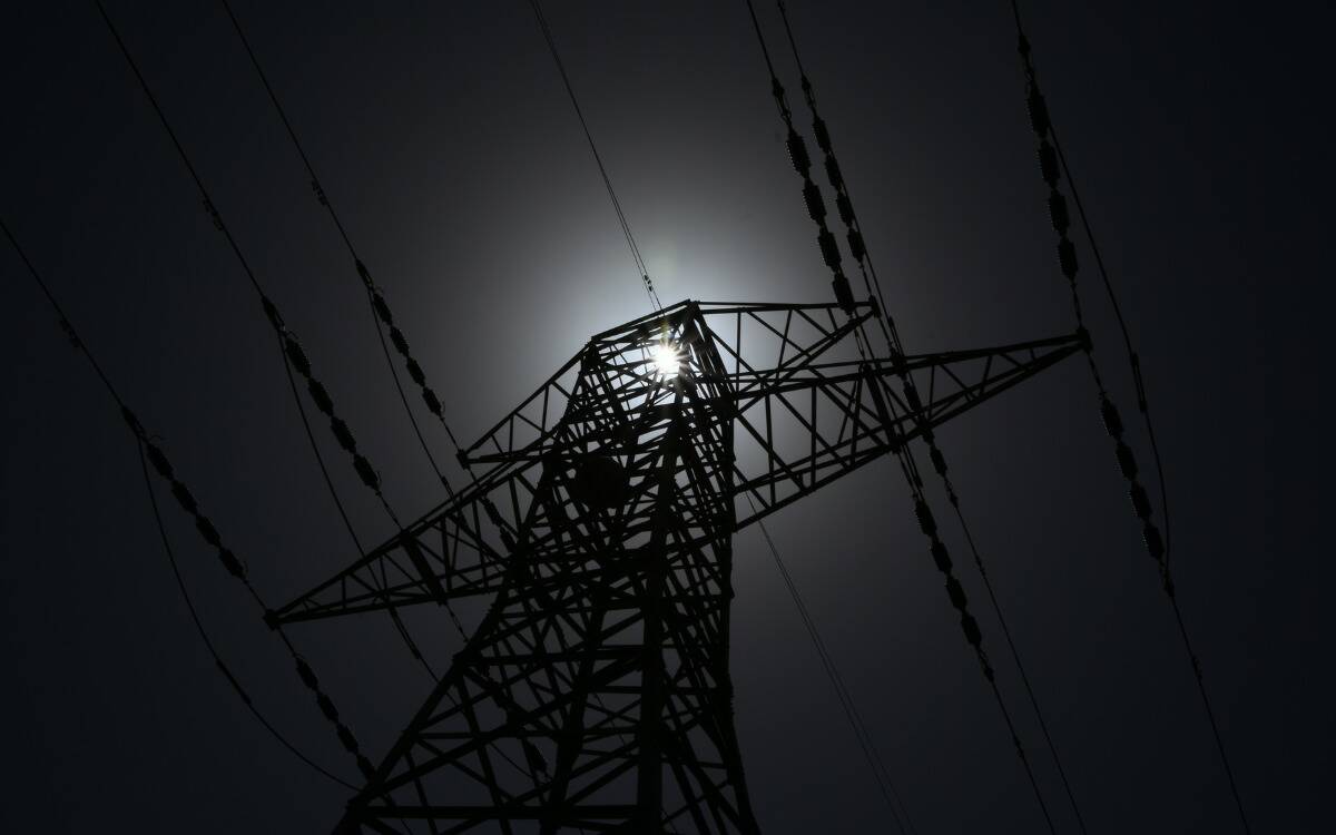 An electrical tower in the dark.