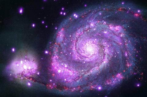 Nearly a million seconds of observing time with NASA's Chandra X-ray Observatory has revealed a spiral galaxy similar to the Milky Way glittering with hundreds of X-ray points of light.