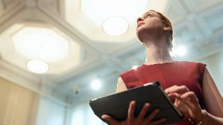 A low angle shot of a powerful woman looking foward.