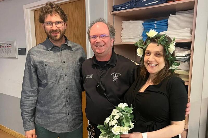 Nora and Michael with the EMT who officiated their wedding.