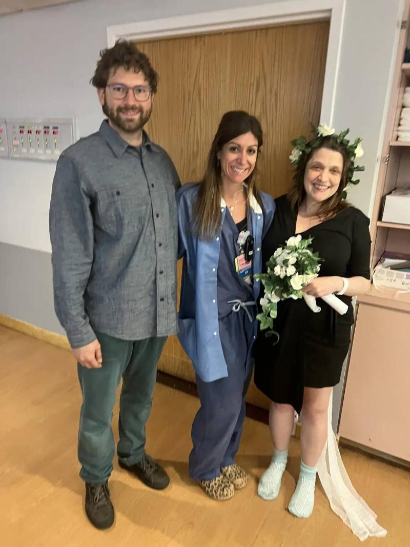 Nora and Michael with the nurse who helped them get married.