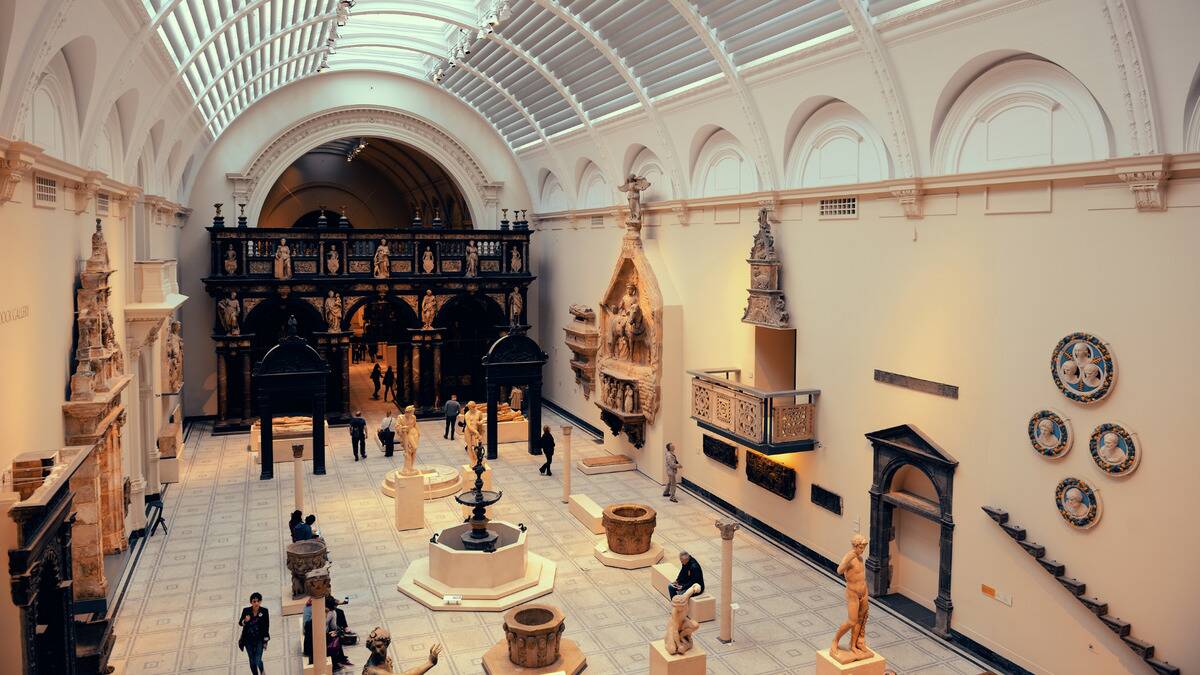 A high angle shot of a room at a museum and all the artifacts it holds.