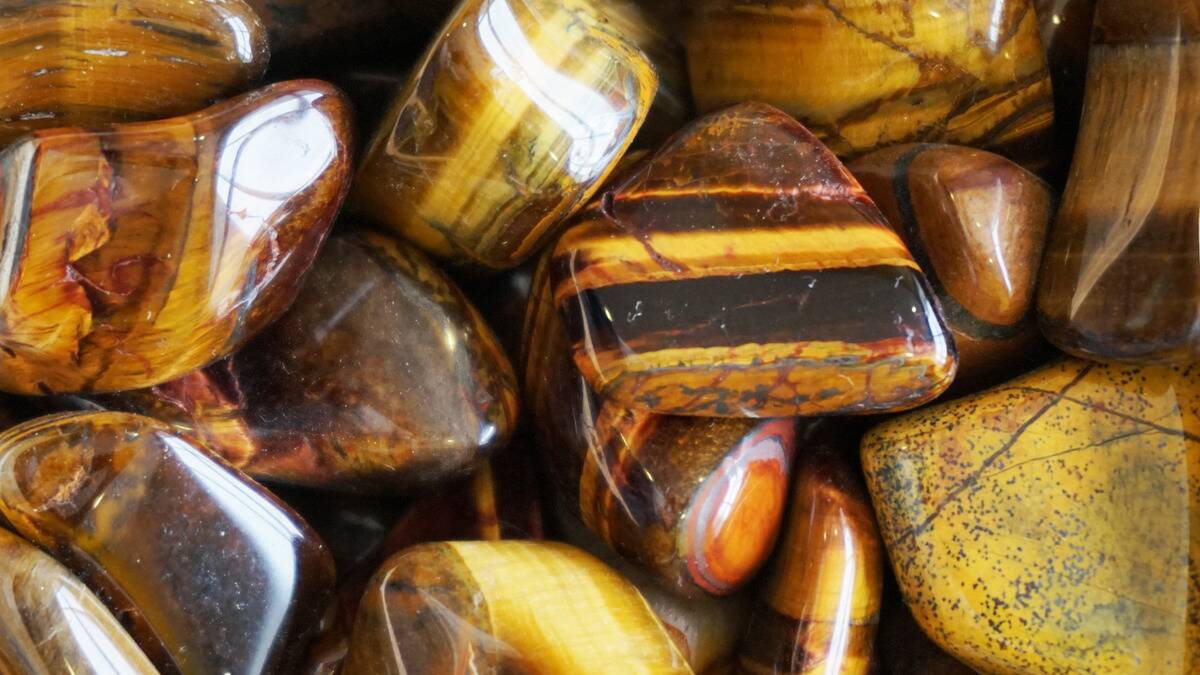 A closeup of some Tiger's Eye tumbles.