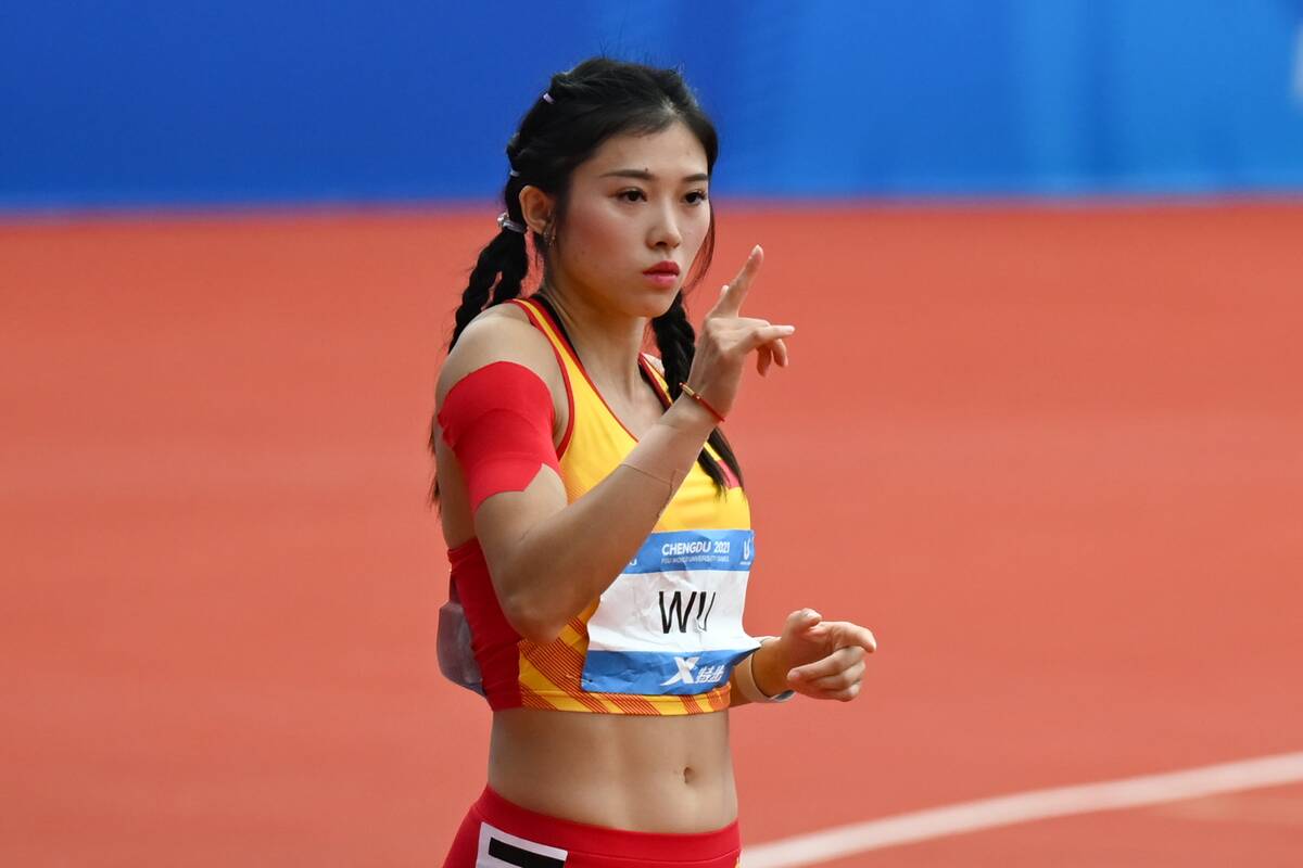 CHENGDU, CHINA - AUGUST 03: Wu Yanni of China reacts in the Women's Athletics 100m Hurdles Round 1 Heat 4 on day 6 of 31st FISU Summer World University Games at Shuangliu Sports Centre Stadium on August 3, 2023 in Chengdu, Sichuan Province of China.