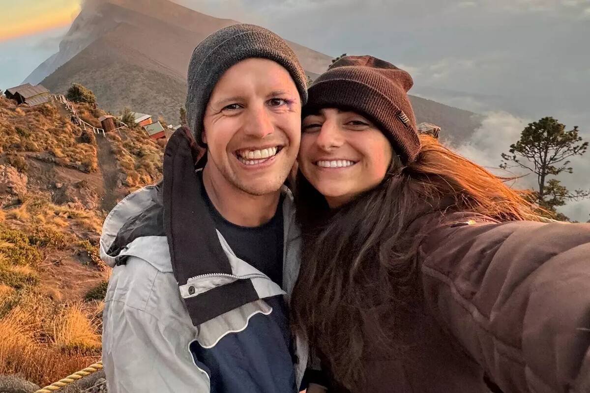 Cody Bryant and Haley Woloshen in a selfie they're taking outside in the mountains.