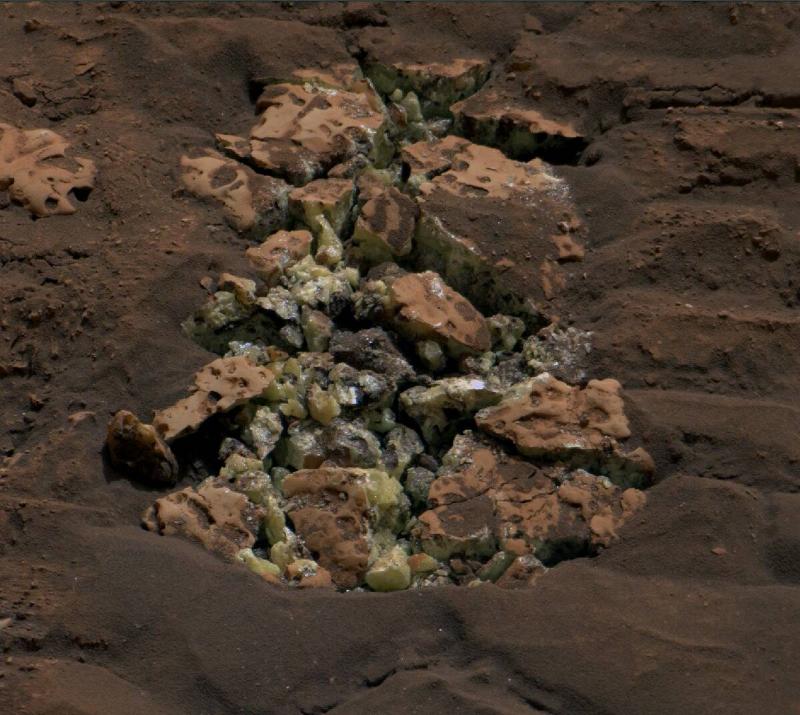 A photo from curiosity of the rock it crushed to reveal sulfur inside.