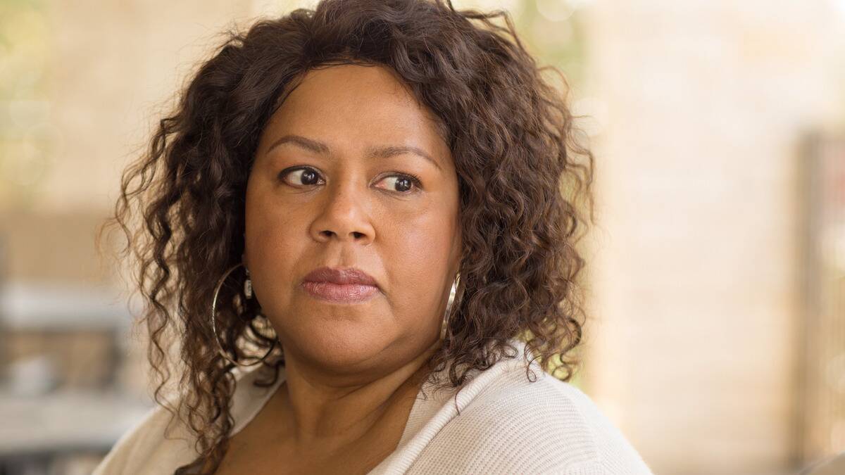 A close shot of a woman looking concerned.