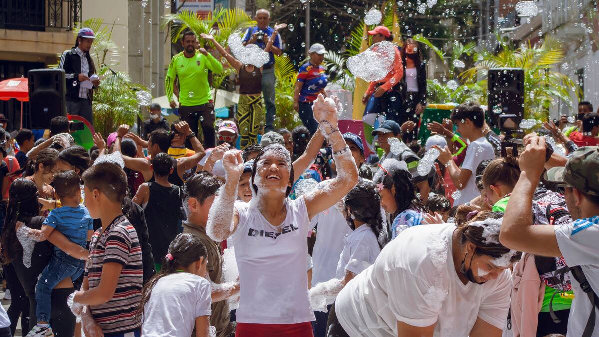 PA group of people dancing in a crowd at an event.