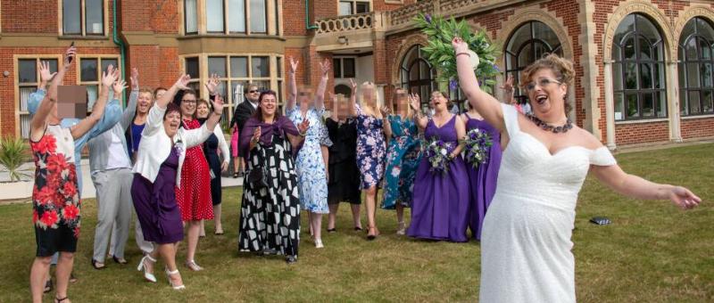 Wilkinson tossing her bouquet into her crowd of guests.