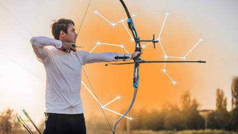 A man drawing an arrow back in a bow. There's orange smoke behind him and a graphic of the Sagittarius constellation.