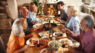 A family gathered around a table for a holiday dinner.