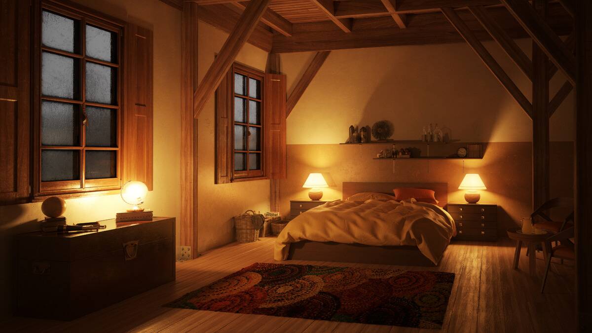 A warmly-lit bedroom, looking very cozy.