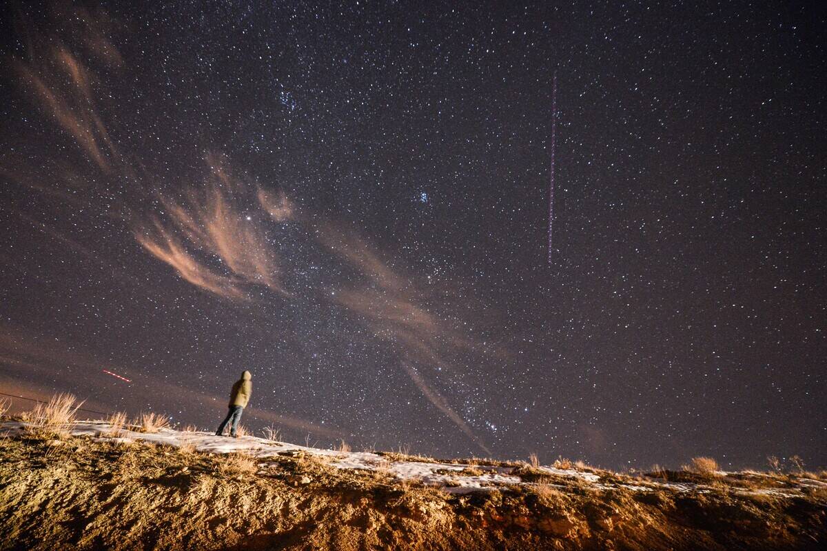 A man looks at the sky during the Geminid meteor shower in Van, eastern Turkey on December 13, 2017.