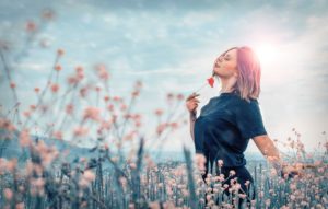 woman in a pretty field of flowers