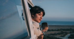 woman looking out of car window