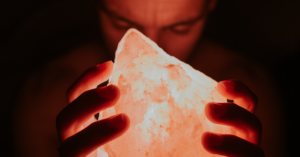 man holding salt lamp