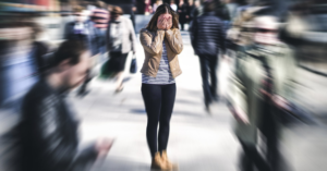 woman in focus in a crowd of unfocused people