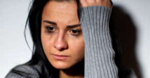 woman crying with mascara running down her face