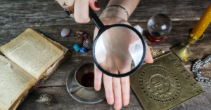 woman use magnifier over palm lines