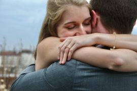 woman hugs man tightly